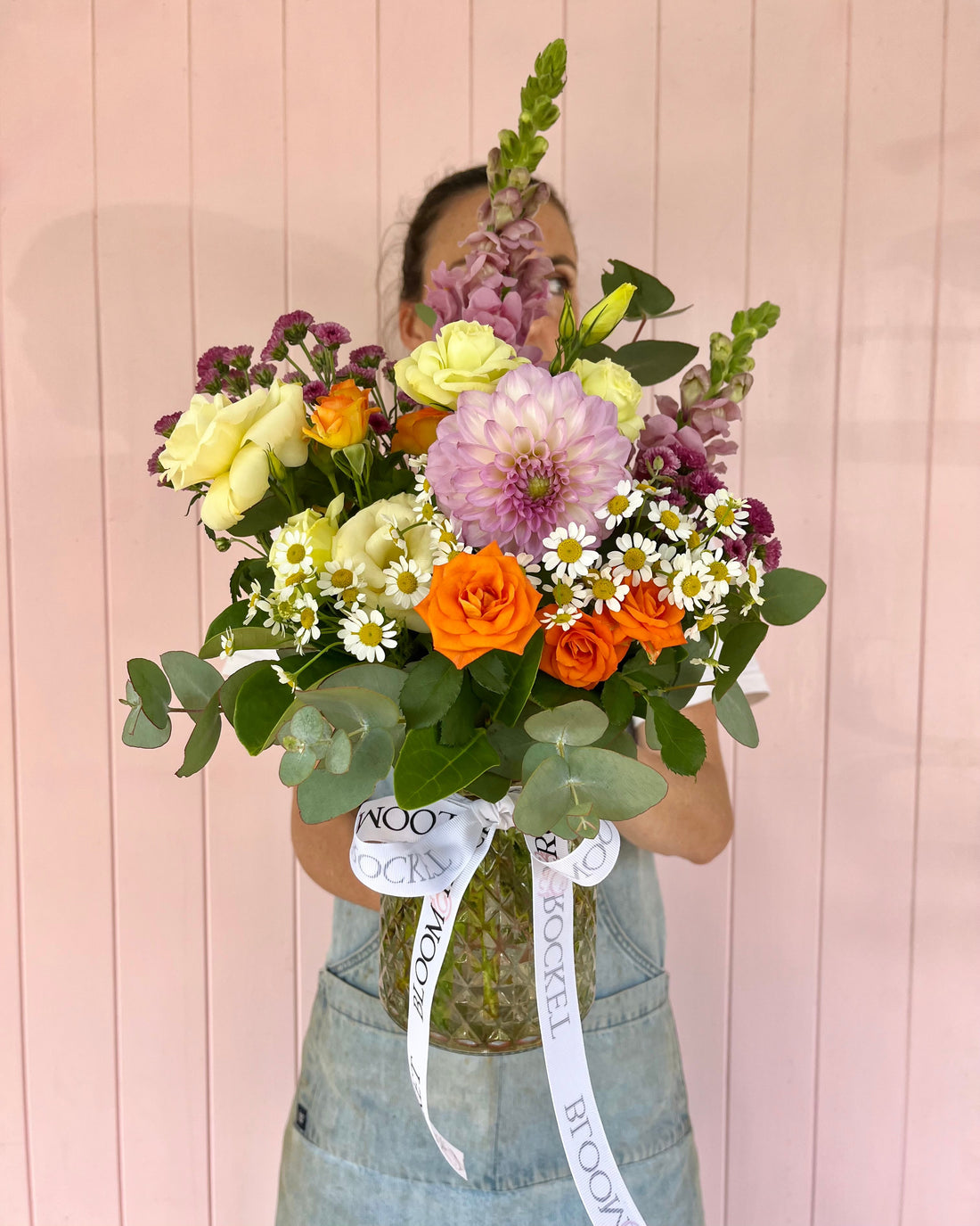 Bright pastel small vase arrangement featuring seasonal flowers arranged in a clear vase. Bloom and Rocket Florist, Brisbane