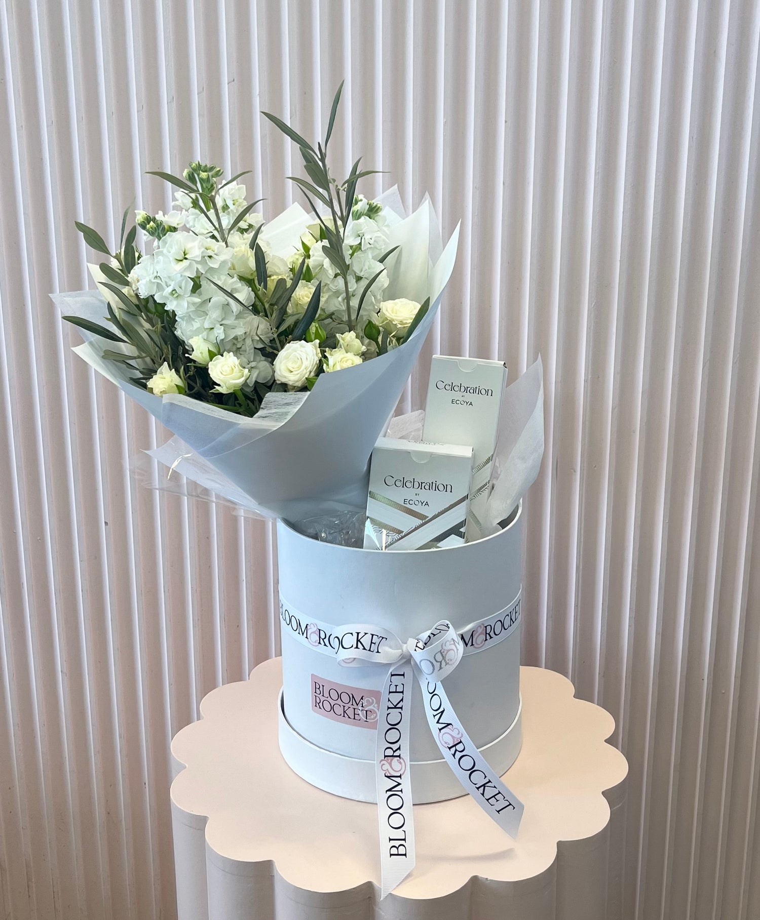 Celebration hamper featuring white flower bouquet with candle and diffuser set. Bloom and Rocket Florist Brisbane.