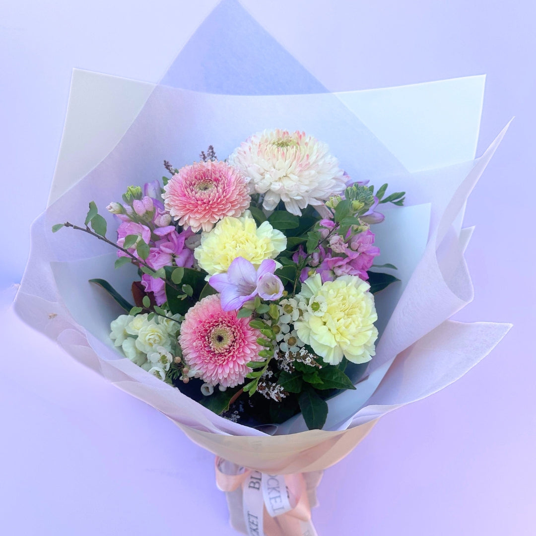 Pastel bloom bouquet featuring seasonal flowers in white, pink, lemon and lilac. Bloom and Rocket Florist Brisbane.