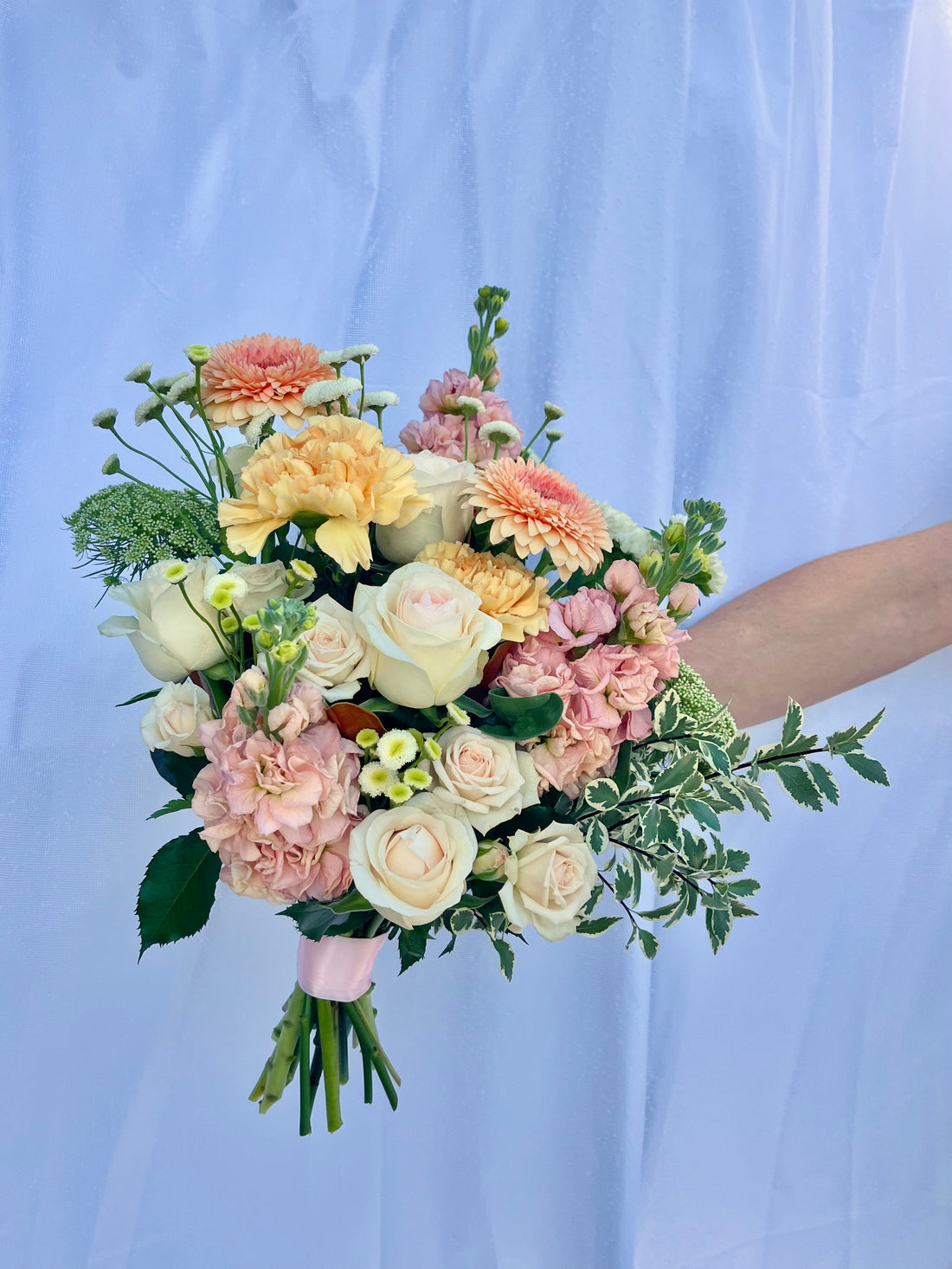 Peach pastel flower bridal bouquet featuring seasonal flowers. Perfect for wedding or events. Bloom and Rocket Florist, Brisbane.