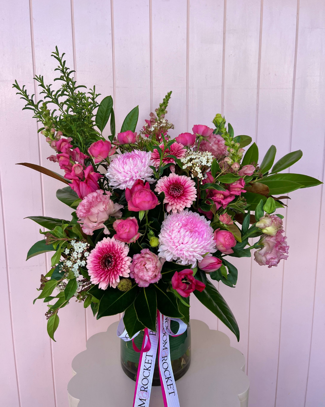 Luxury pink vase arrangement with a selection of seasonal florals arranged in a clear vase. Bloom and Rocket Florist Brisbane. Same day flower delivery.