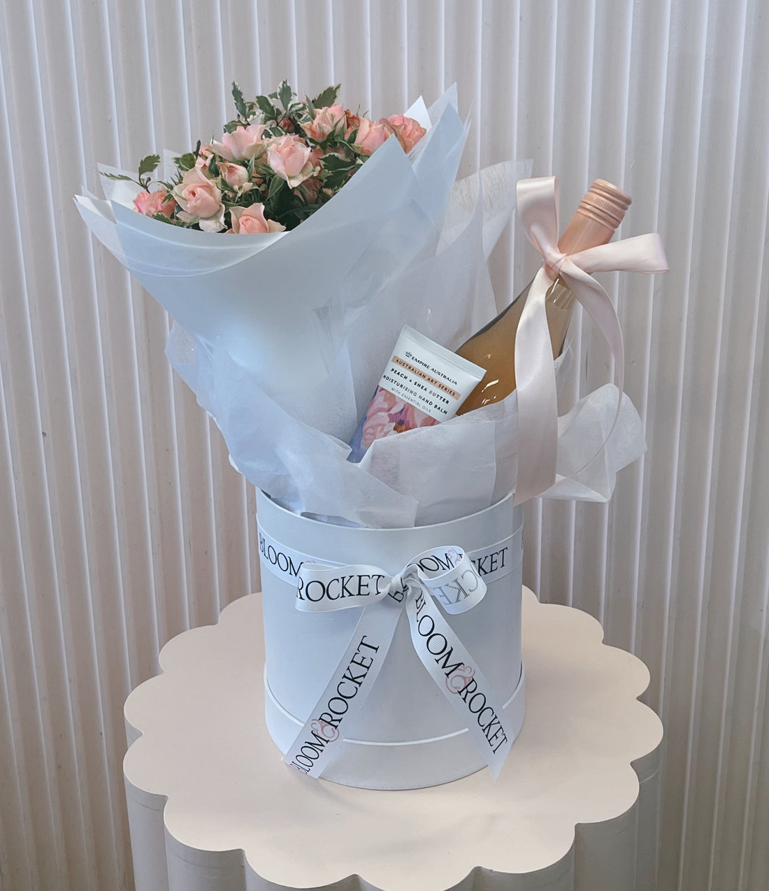 Gift hamper with rose wine, flowers abd hand cream. Bloom and Rocket Florist Brisbane.