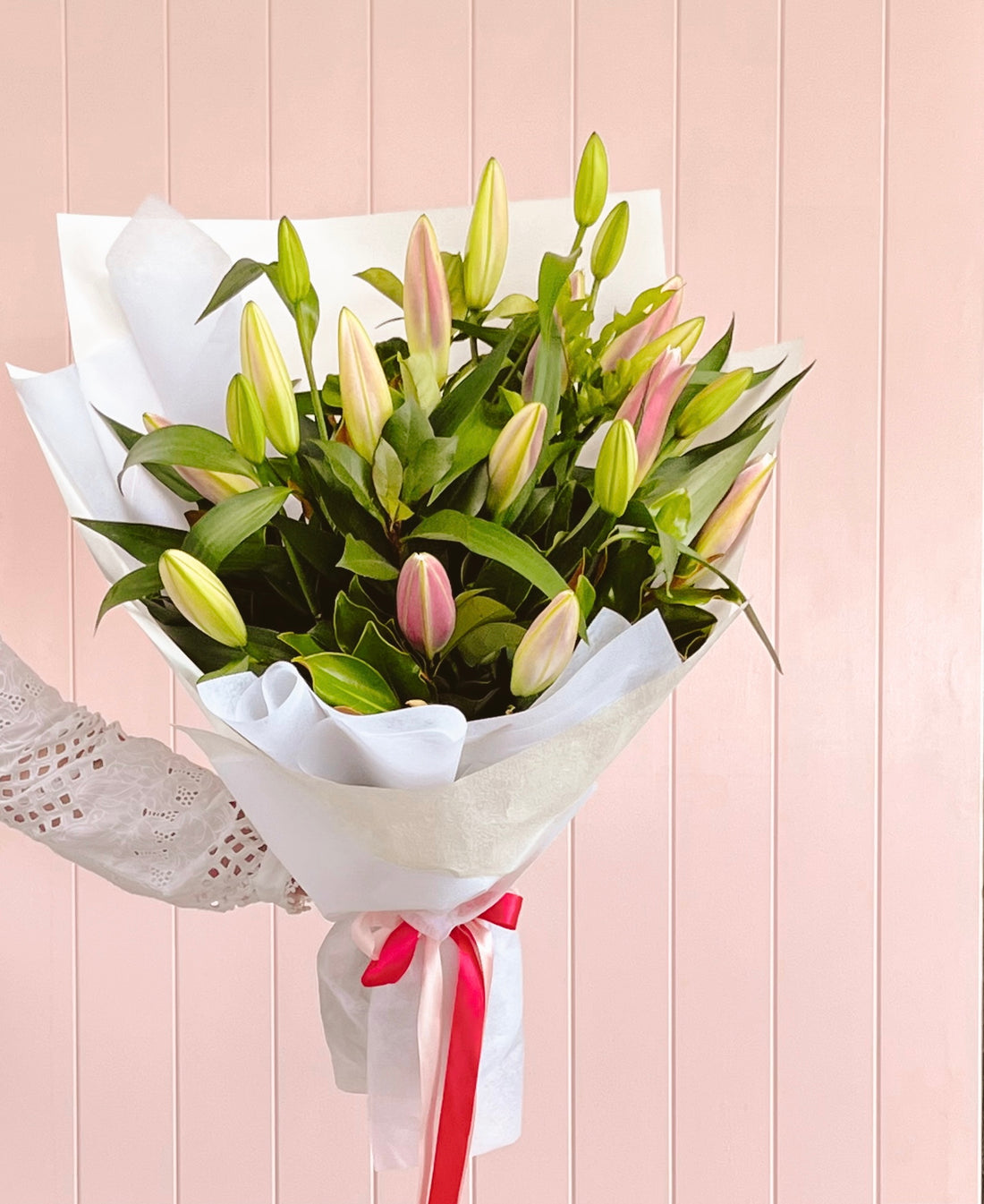 A bunch of Oriental Lilies with green leaves. Brisbane flower delivery. Bloom and Rocket Florist. Same day delivery. Taringa, St Lucia, Toowong, Indooroopilly and Brisbane wide.