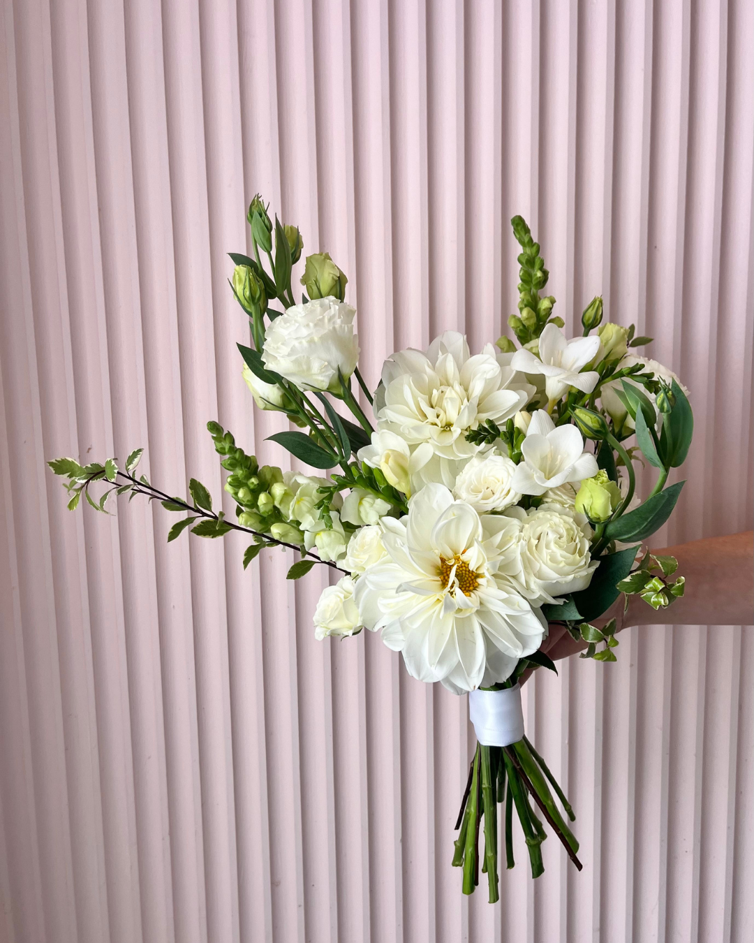 White flower bridal bouquet featuring seasonal flowers. Perfect for weddings or events. Bloom and Rocket Florist, Brisbane.