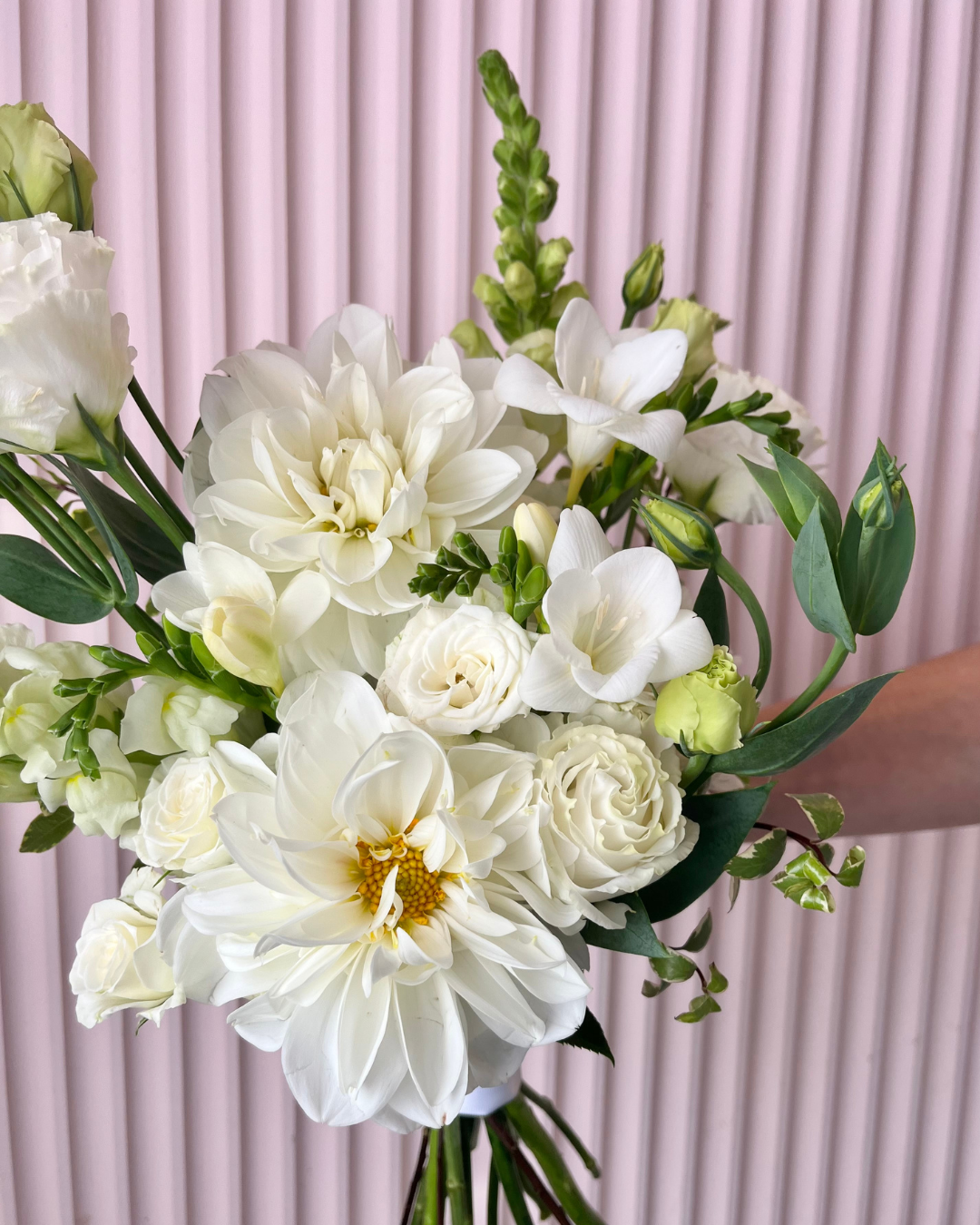 White flower bridal bouquet featuring seasonal flowers. Perfect for weddings or events. Bloom and Rocket Florist, Brisbane.
