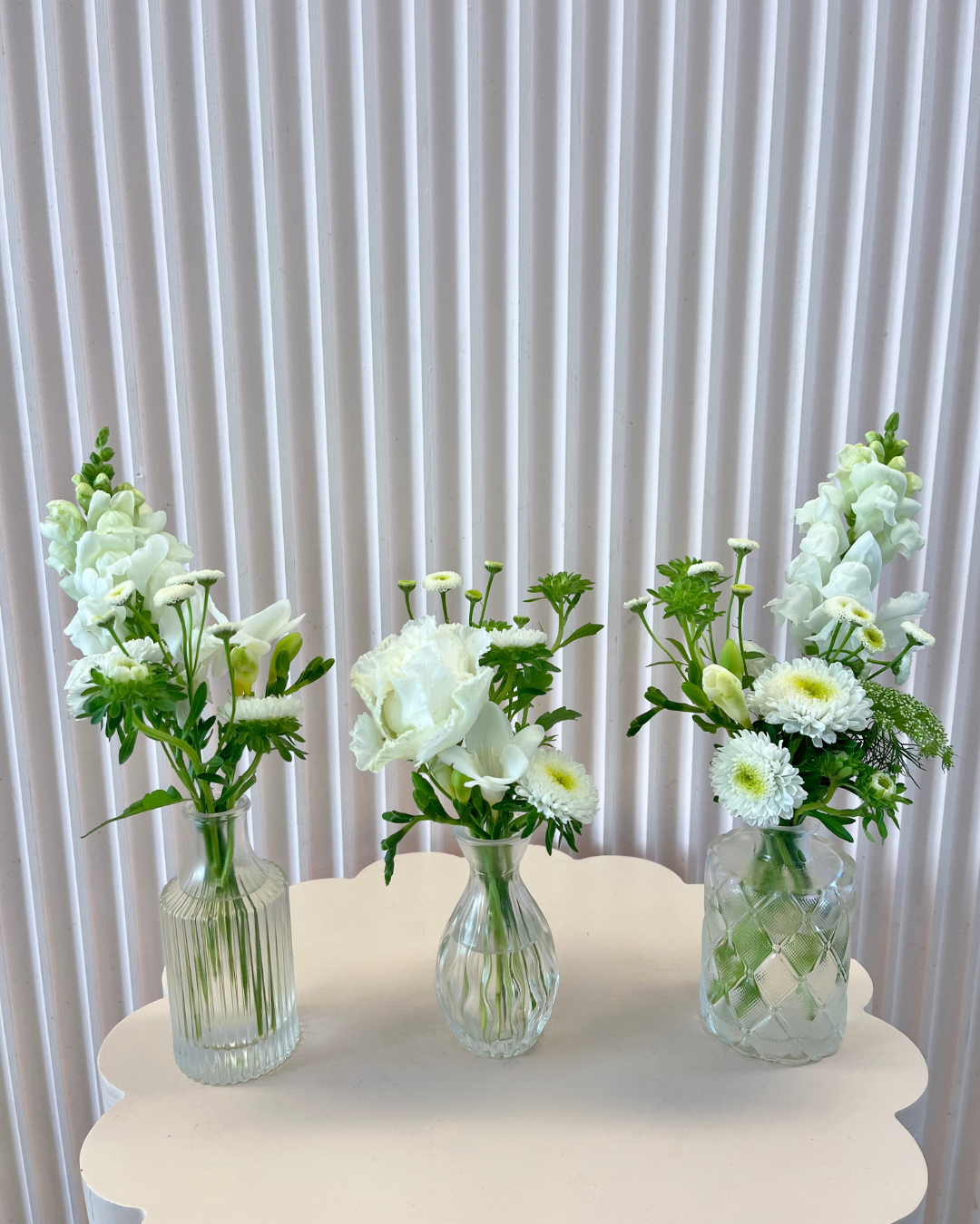 White flower bud vases arranged for event or wedding table centrepieces. Bloom and Rocket Florist, Brisbane.