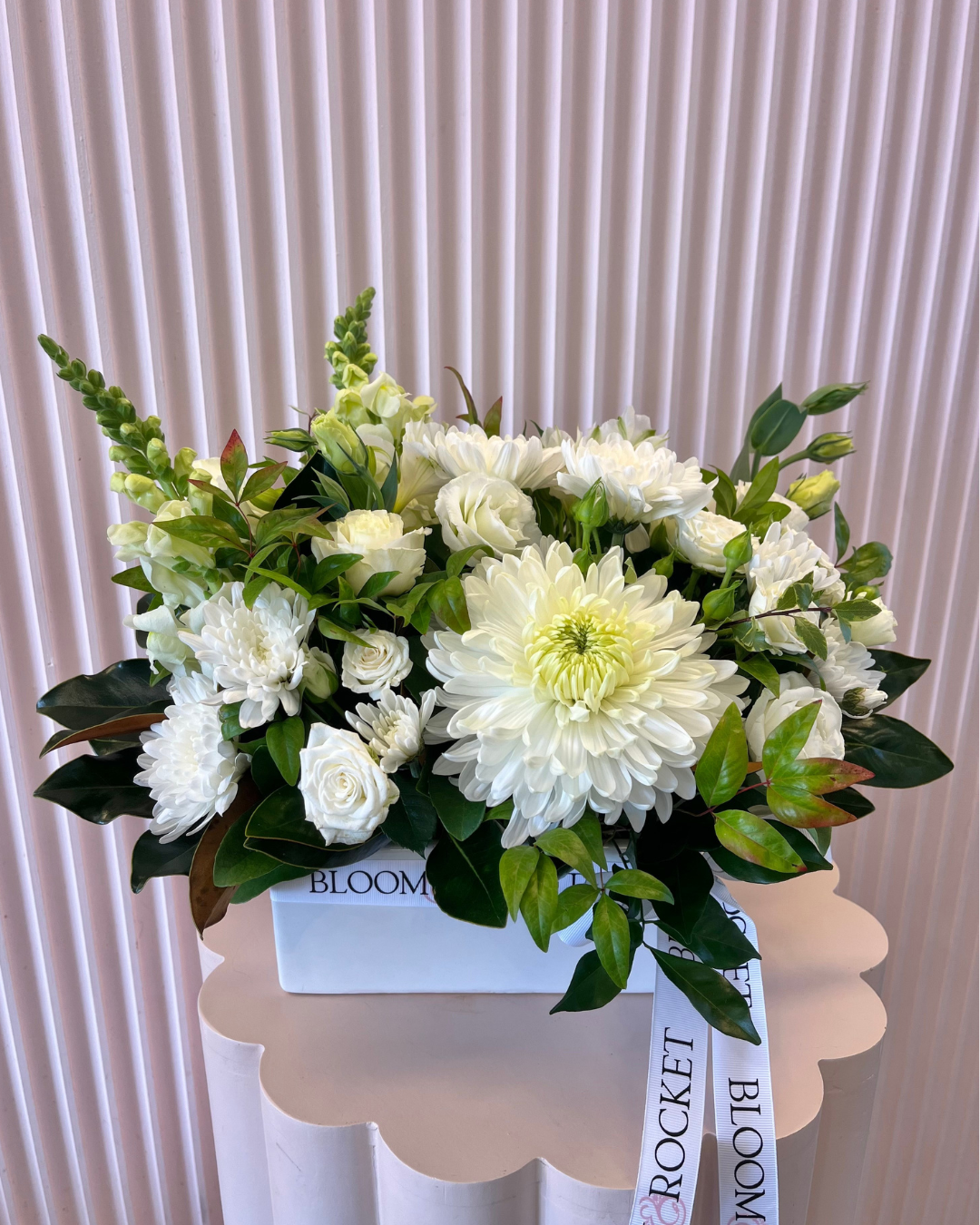 White ceramic trough arrangement featuring seasonal flowers. Bloom and Rocket Florist Brisbane.