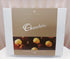 A box of Chocolatier brand chocolate truffles, with a picture of the truffles on a white background. The packaging is primarily white and brown with text and the Chocolatier logo. Bloom and Rocket Florist Taringa. Brisbane Flower Delivery.