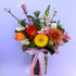 Colours of the season posy vase arrangement featuring seasonal flowers  and foliage. Bloom and Rocket Florist Brisbane.
