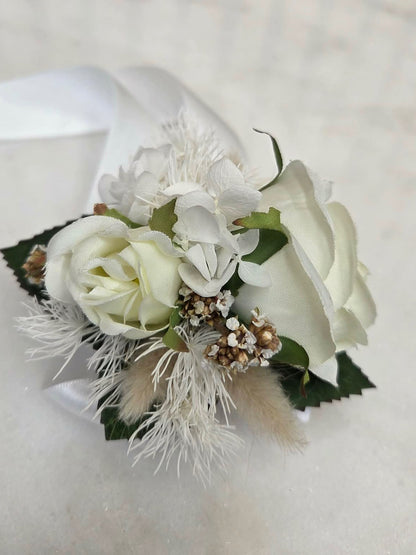 Floral corsage with white roses preserved wrist corsage.