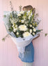 Sympathy and funeral sheaf. White flowers Bloom and Rocket Florist Brisbane.