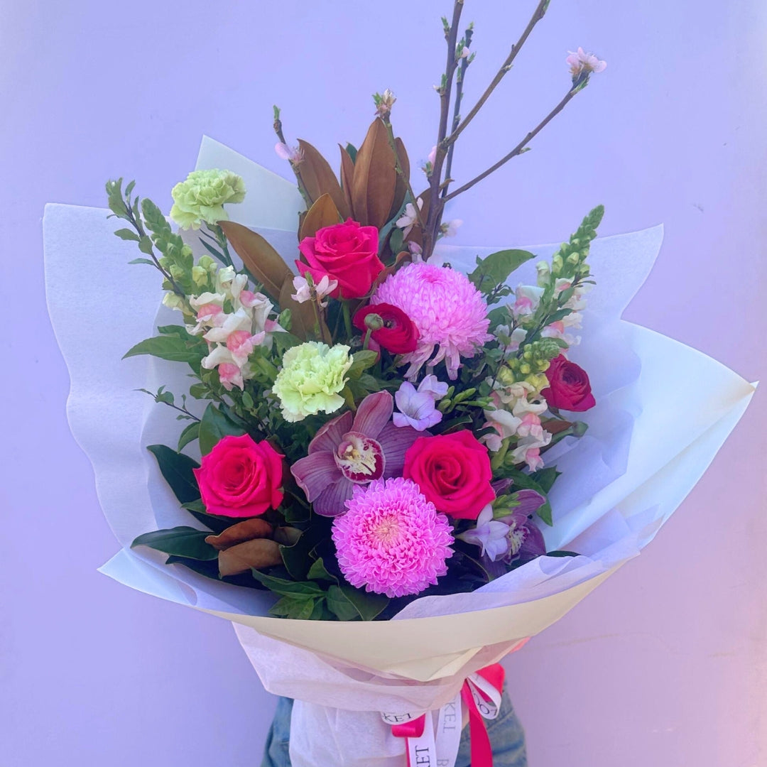 In Full Bloom bouquet featuring hot pink, purple and green seasonal flowers. Bloom and Rocket Florist Brisbane.