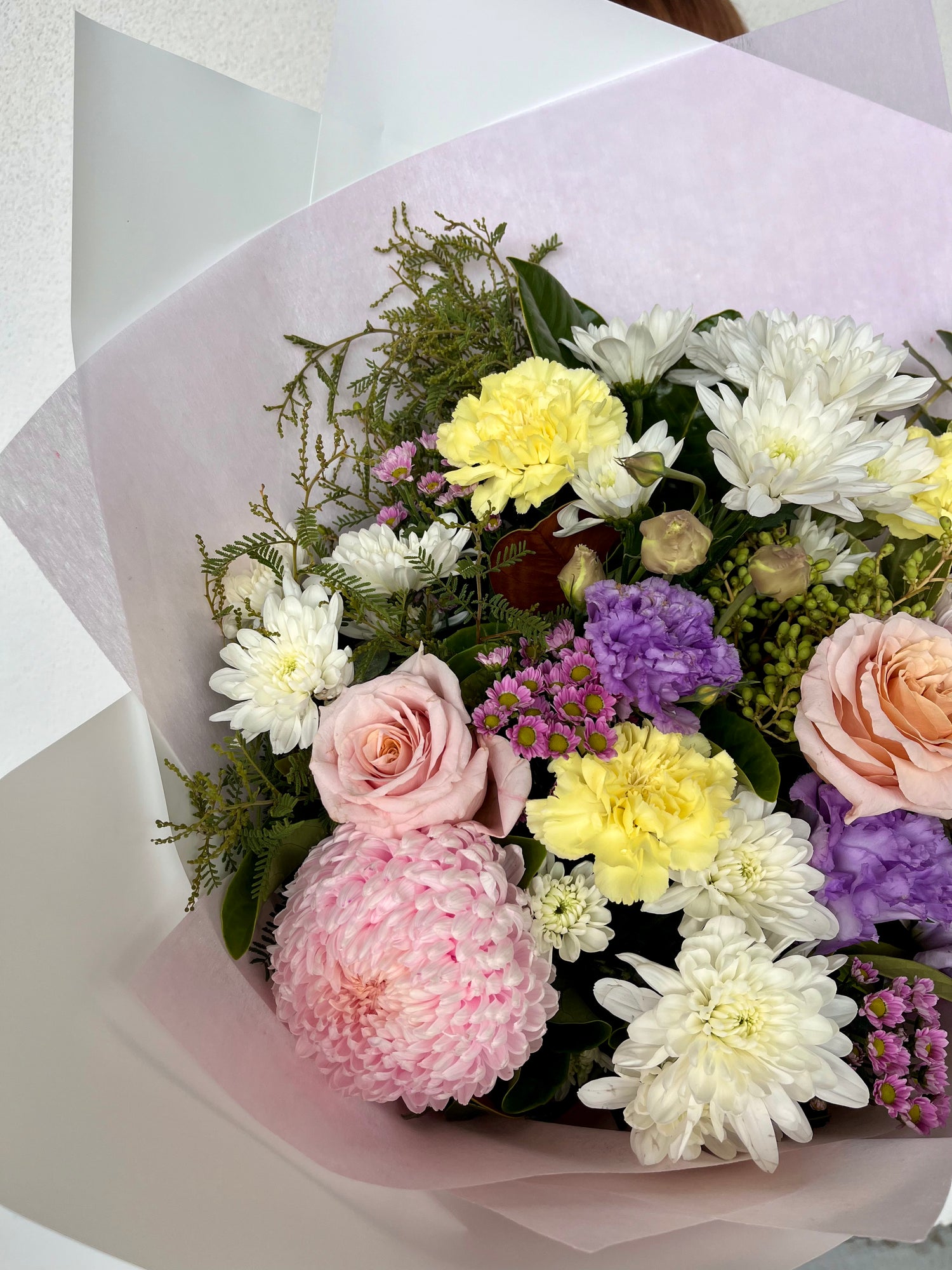 Bouquet of flowers with pink, yellow, and white colors. Mother&