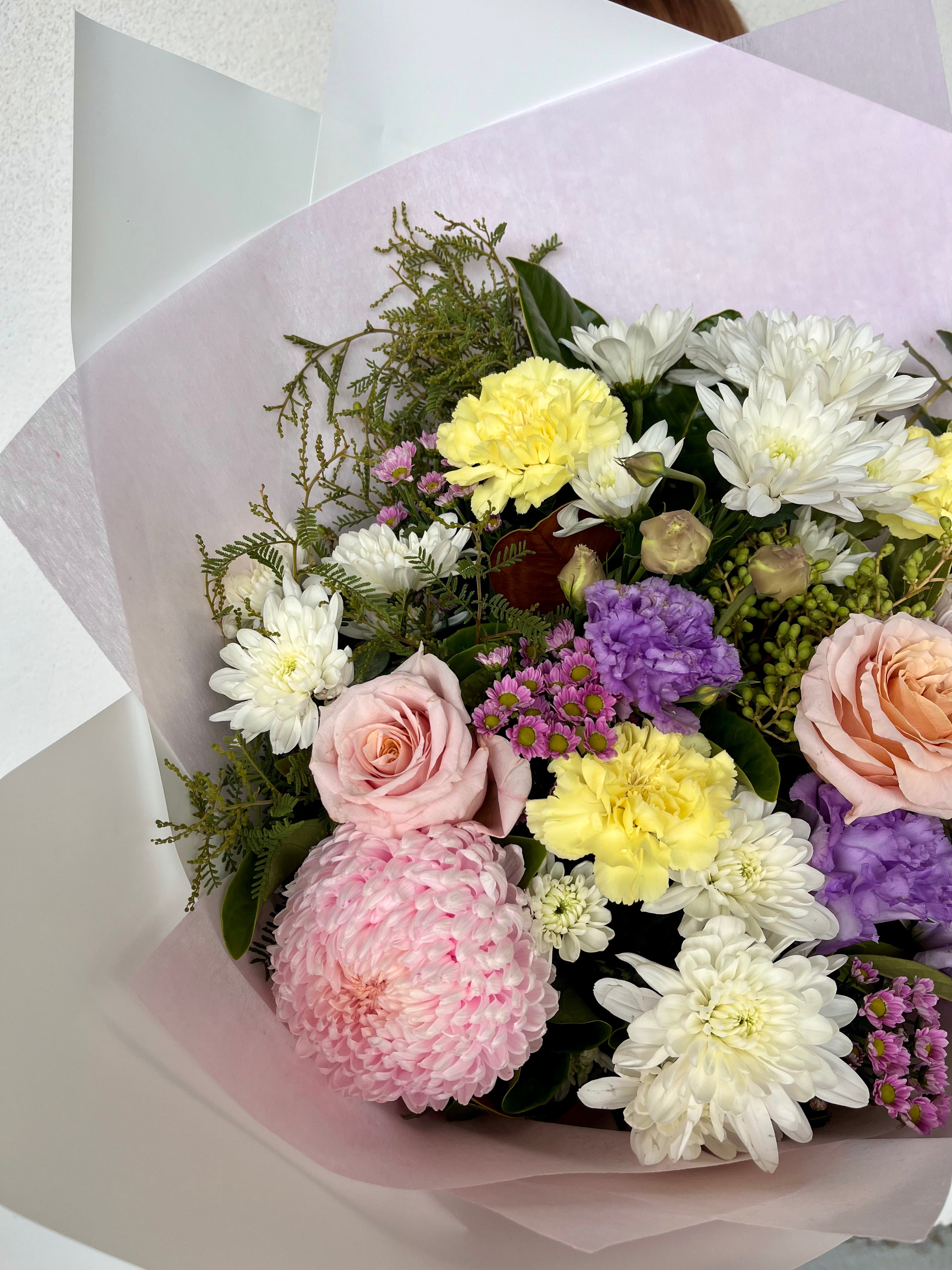 Bouquet of flowers with pink, yellow, and white colors. Mother&