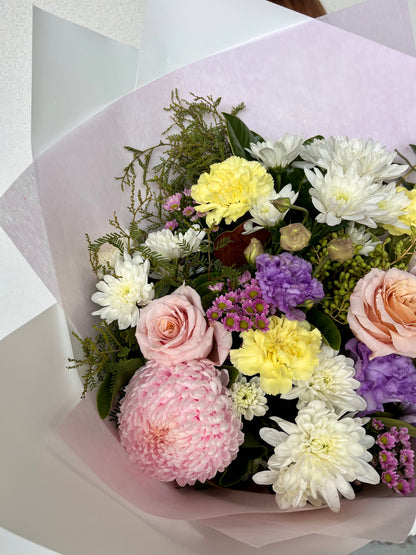 Bouquet of flowers with pink, yellow, and white colors. Mother&