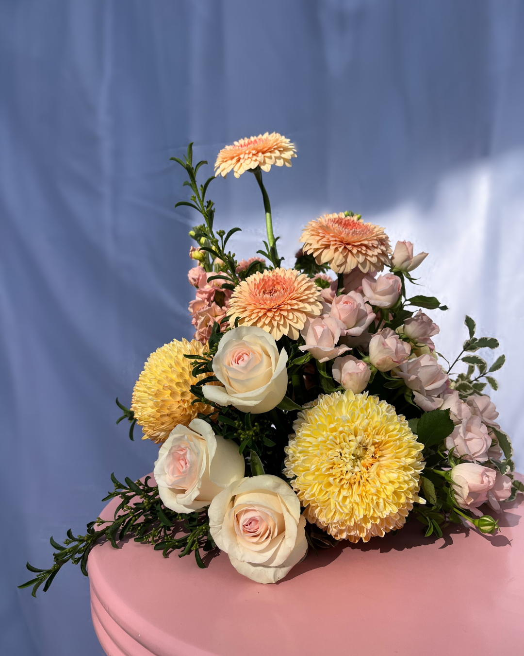 Pastel flower table arrangement with a selection of seasonal flowers. Perfect for wedding or event florals. Bloom and Rocket Florist, Brisbane.