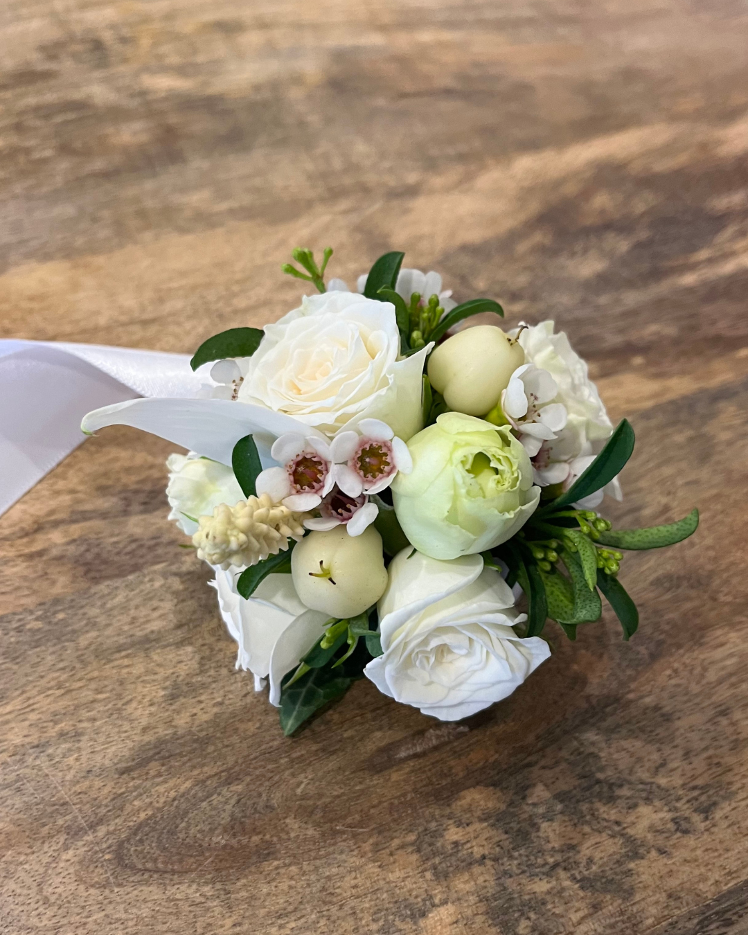Premium luxury floral wrist corsage featuring seasonal flowers. Perfect for weddings, formals and events. Bloom and Rocket Florist, Brisbane