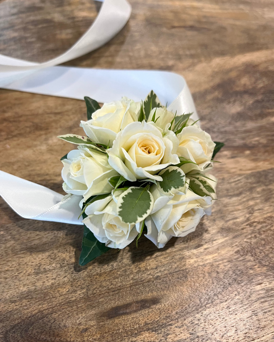 Premium rose wrist corsage featuring seasonal flowers. Perfect for weddings, formals and events. Bloom and Rocket Florist, Brisbane